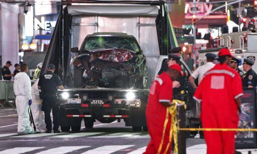 The car driven by a man who steered his car onto a busy Times Square sidewalk, killing a teenager and injuring nearly two dozen others, is removed by police and investigators from the crime scene area, Thursday, May 18, 2017, in New York. The driver, a 26-year-old U.S. Navy veteran, told officers he was hearing voices and expected to die, two law enforcement officials said. (AP Photo/Kathy Willens)