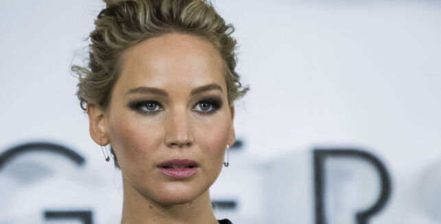 FILe - In this Dec. 1, 2016, file photo, actress Jennifer Lawrence poses for photographers during a photo call to promote the film "Passengers," in London. Lawrence condemned Harvey Weinstein in a statement released early Tuesday, Oct. 10, 2017, but said he never sexually harassed her and she had no first-hand knowledge of any harassment allegations. (Photo by Vianney Le Caer/Invision/AP, File)
