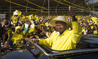 FILE - In this Tuesday, Feb. 16, 2016 file photo, Uganda's long-time President Yoweri Museveni waves to supporters from the sunroof of his vehicle as he arrives for an election rally at Kololo Airstrip in Kampala, Uganda. One of Africa's longest-serving leaders, Museveni could rule until 2031 after lawmakers late Wednesday, Dec. 20, 2017 passed contentious legislation that many in the East African nation saw as an attempt by the president to rule until the grave. (AP Photo/Ben Curtis, File)